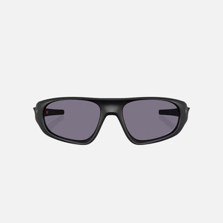 Black sunglasses with dark lenses on a light gray background